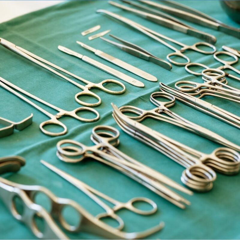 Surgical instruments arranged on a green sterilized cloth