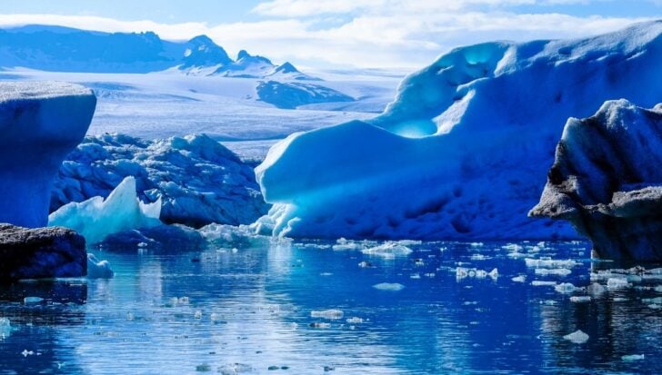 The Arctic Ocean with icebergs and ice covering a vast portion of the water surface during winter