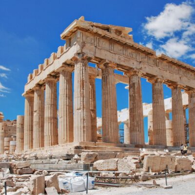 The Parthenon temple ruins under a clear blue sky in Athens, Greece