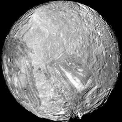 Surface of Uranus' moon Miranda showing Verona Rupes cliff and geological ridges