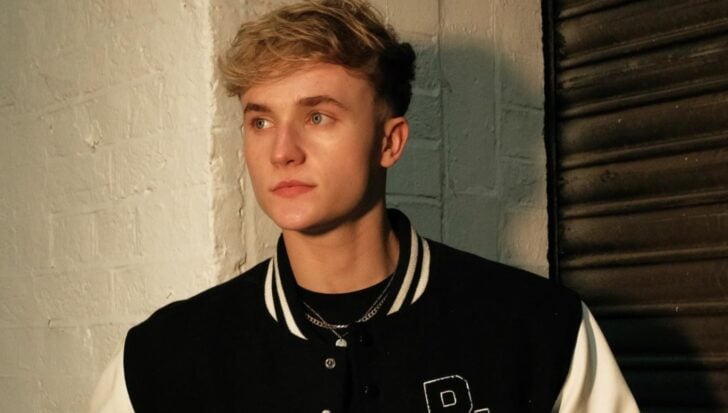 Seán Hayden wearing a black and white varsity jacket