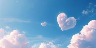 Heart-shaped clouds in a blue sky
