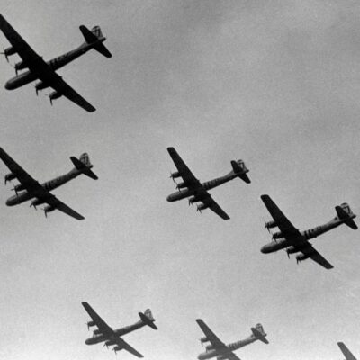 Formation of WWII-era four-engine bombers in flight