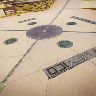 Circular marker at Four Corners showing lines where Utah, Colorado, Arizona, and New Mexico meet