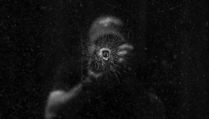 Dark surface with a circular crack pattern