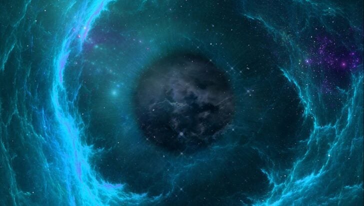 A black hole surrounded by swirling blue light and stars