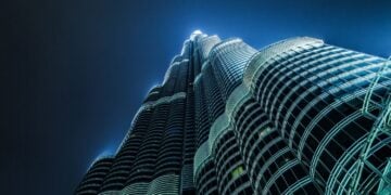 Looking up at the illuminated exterior of the Burj Khalifa at night