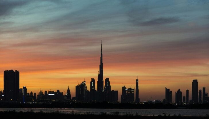 The Burj Khalifa standing tall against a colorful sunset
