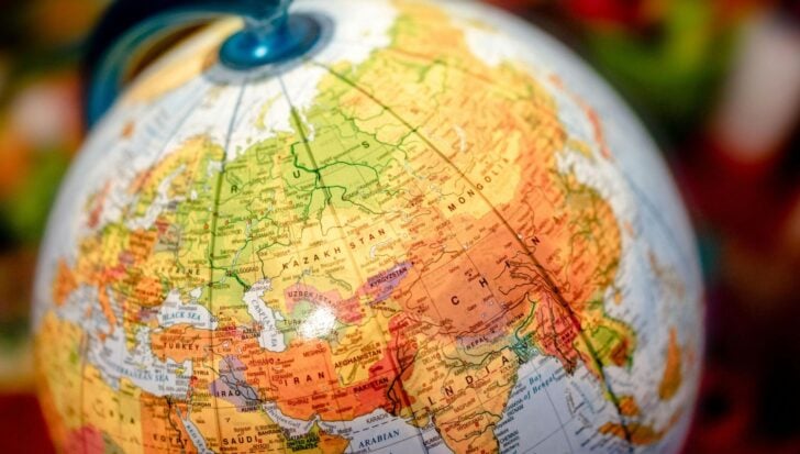A globe highlighting countries in Asia and parts of Europe and the Middle East, including Russia, Kazakhstan, and India